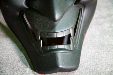 Close up view of devil head mask teeth on gray color backgroundの写真素材