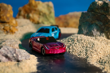 Miniature car model on sand beach. Concept of travel and vacation.の写真素材