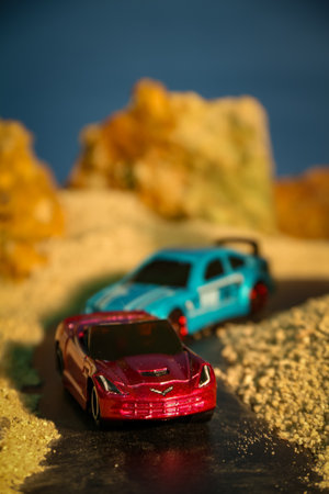 Car model on the sand with sea background. Selective focus.の写真素材