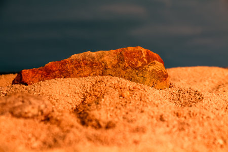 Close-up of sand and stone on the beach. Selective focus