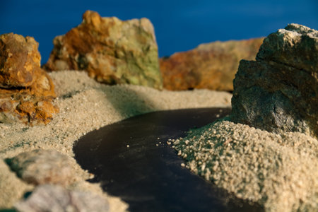 The background theme is rocks and sand with a black road with bright light like the afternoon sun