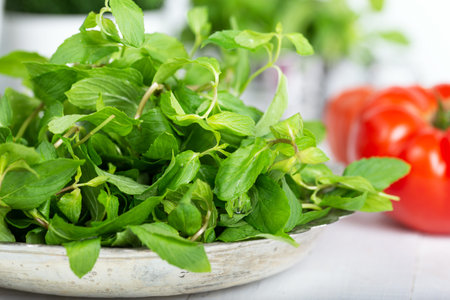 Mint. Bunch of Fresh green organic mint leaf on wooden table closeup