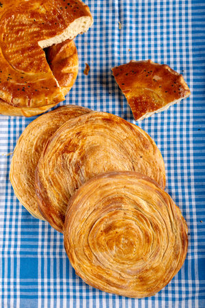 Homemade circle bread and Turkish flaky pastry (katmer)
