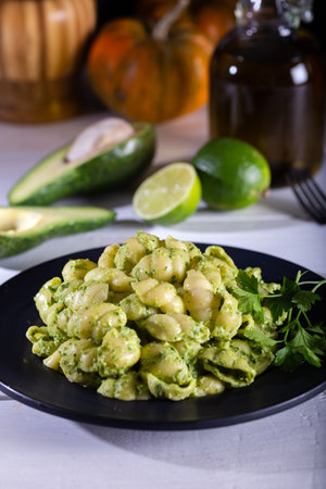 Pasta with pesto sauce on wooden background.の写真素材