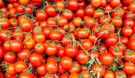 Cherry tomatoes for sale at a farmers market. Cherry tomatoes background