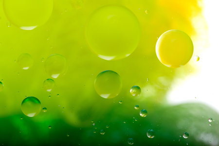 Oil mixed with water, abstract colorful background. Green background and texture.