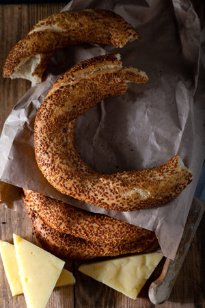 Turkish bagels with cheese on wooden background.