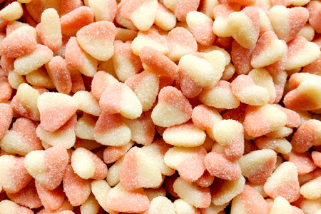 A closeup shot of a pile of pink sugar coated marshmallows