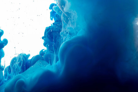 Ink drop in water. Abstract background. Blue background