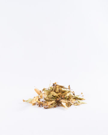 Dried linden leaves and flowers on white background.の写真素材