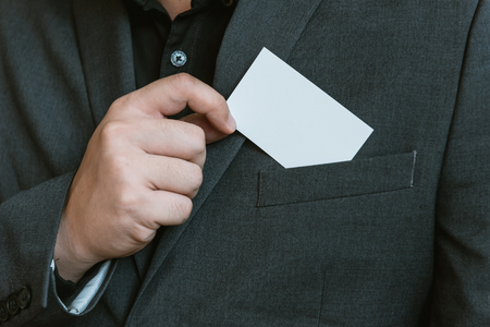 Business man holding white business card.の写真素材