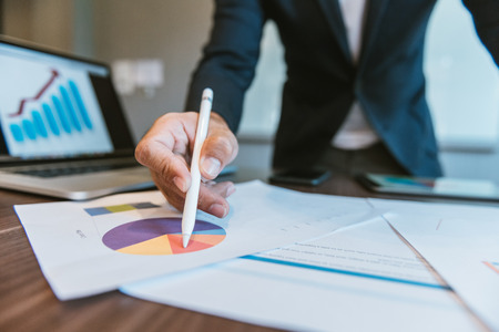 Business concept, Business man working at office with tablet computer and documents on his work spaceの写真素材