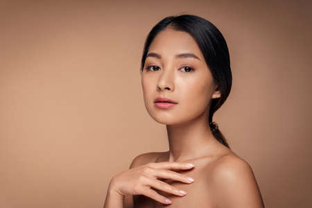 Beauty young asian woman with bare shoulder and clean fresh healthy skinの写真素材