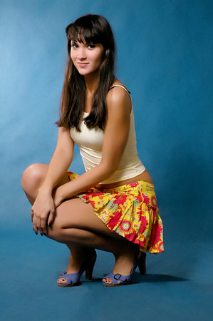 The beautiful girl on a dark blue backgroundの写真素材