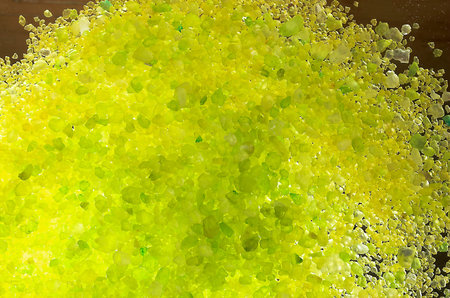 The invoice from yellow salt for bathing on a dark backgroundの写真素材