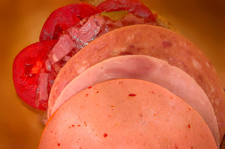 Sandwich with sausage and tomatoes
