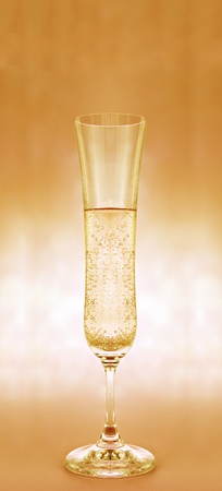 a glass of champagne on pink backgroundの写真素材