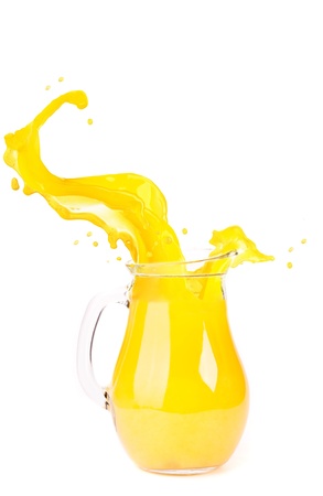 orange juice splash isolated on whiteの写真素材