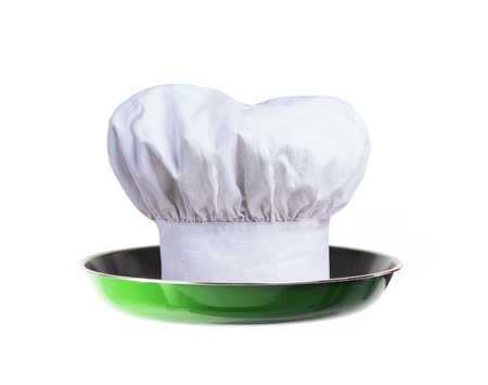 A professional chefs hat on pan - conceptの写真素材
