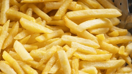 fried potatoes closeup background or textureの写真素材
