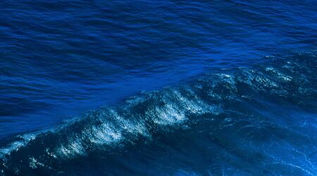 Big ocean wave close up isolated blueの写真素材