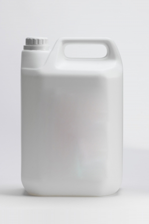 A single motor oil bottle isolated on whiteの写真素材