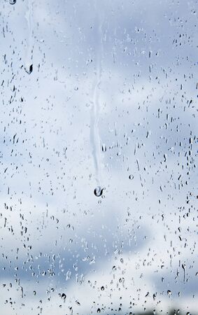 natural water drops on window glassの写真素材