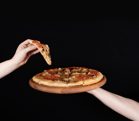 pizza plate on the human handの写真素材