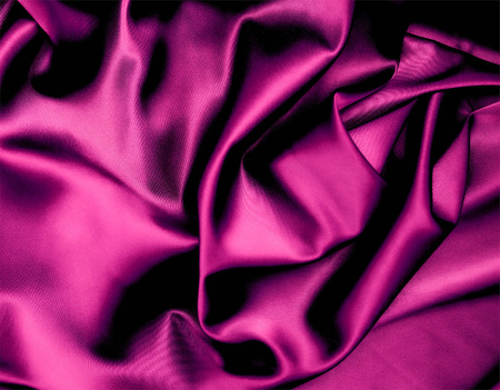 Closeup of rippled purple silk fabricの写真素材