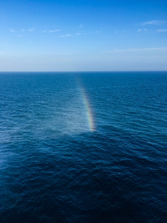 View of rainbow in seaの写真素材