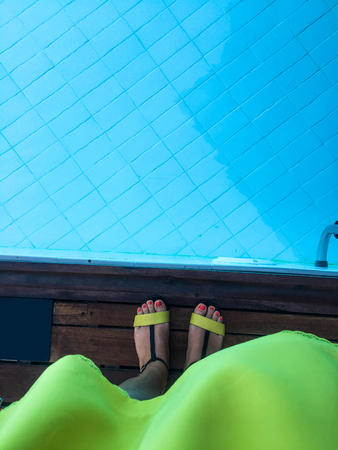 standing at the swimming poolの写真素材