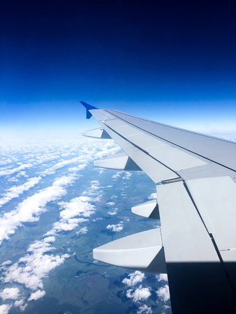 Airplane wing in the skyの写真素材