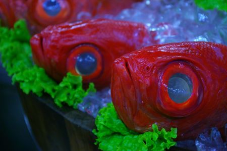 Red fishes with huge eyes in Taiwan seafood restaurant.の写真素材