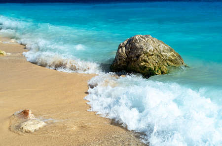 Close up photo of KaputaÅ beach in Antalya with waves and bubbles.の写真素材