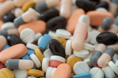 Full of expired pills and medicines in the trash bin with recycling symbol. Waste pills collected to...