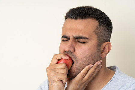 Close up photo of man with toothache or teeth pain. Concept of oral or dental care.