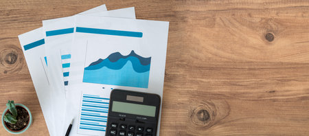 Top view photo of business workers desktop with graphics and statistics. Finance and business accounting concept.の写真素材