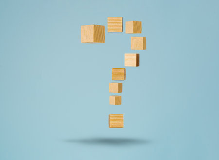 Floating question sign made of wooden blocks. Concept of FAQ and solving problem by providing information and answer.の写真素材