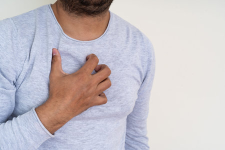 Close up photo of man suffer from acid reflux, heartburn and gerd.