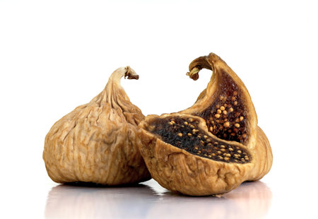 Close up photo of dried figs on isolated white background.の写真素材