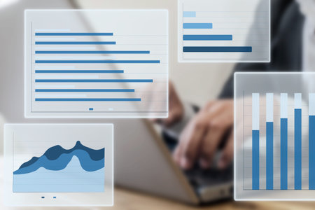 Close up photo of businessman using laptop and computer. Concept of data chart statistics and income and revenue infographics with screen mockup.の写真素材