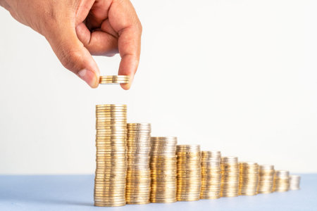 Close up Photo of constantly increasing coins on isolated background. Concept of rising money and climbing investment of new startup.の写真素材