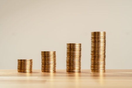 Close up Photo of constantly increasing coins on isolated background. Concept of rising money and...