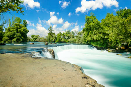 Long exposure wide angle scenic view of Manavgat waterfall in Antalya. selective focus.の写真素材