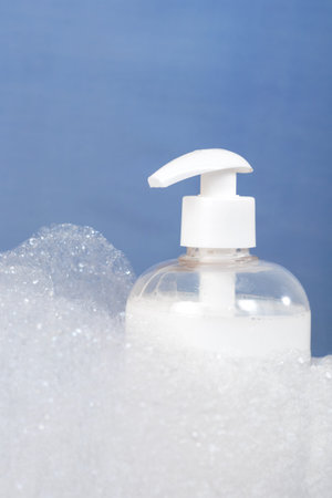 Close up photo of hand soap and bubbles. Hygiene and personal care concept.