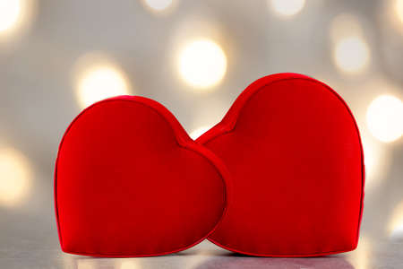 Couples holding heart shaped gift box with bokeh background. Love, gift and present concept.の写真素材