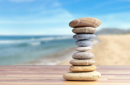 Stacked pebbles to make shape of hourglass as a symbol of time management. Concept of meditation, slow down and controlling time.の写真素材