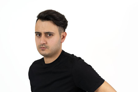 Portrait of a brown skinned man with silky well groomed black hair on isolated white background.