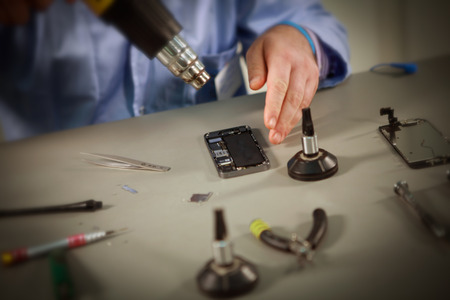 Man repair smartphonesの写真素材