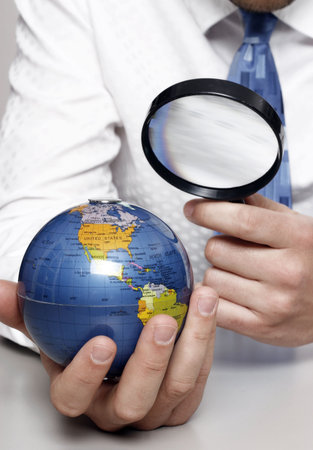 Businessman looking at globe